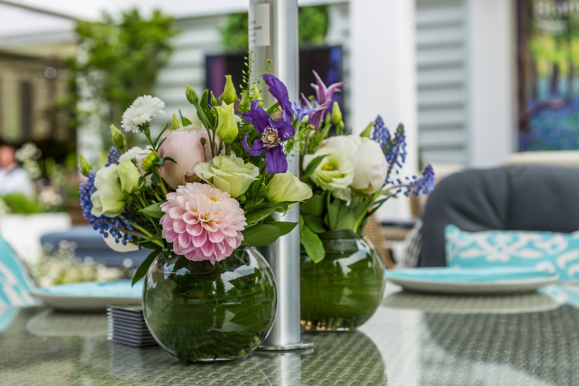 floral table center created from pink, purple and green florals