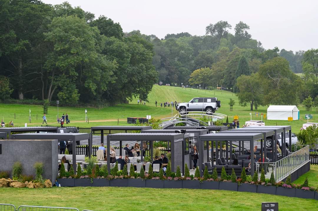 planted troughs at burghley, JLR viewing area, featuring troughs with buxus pyramids