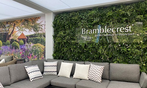RHS Chelsea Flower Show bramblecrest furniture set with living wall in background