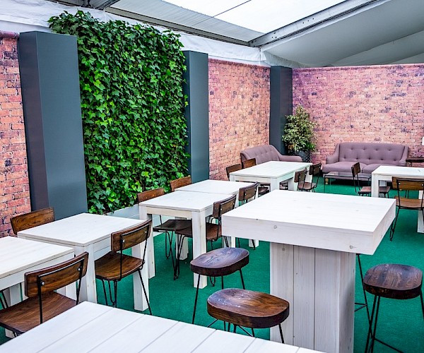 white wooden high tables and chairs